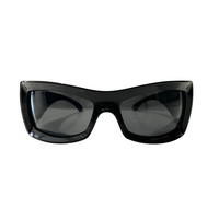 A pair of black oversized sunglasses with a visor style design.
